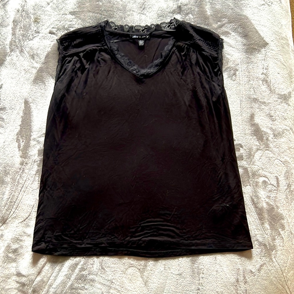Sleeveless blouse with laze detail on neck and shoulder